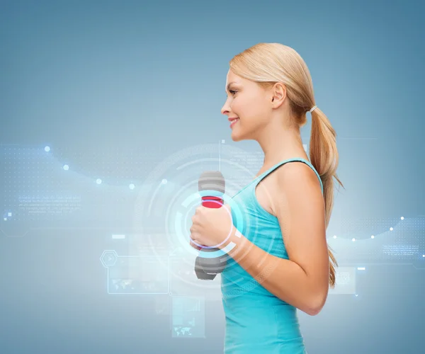 Young sporty woman with light dumbbells — Stock Photo, Image