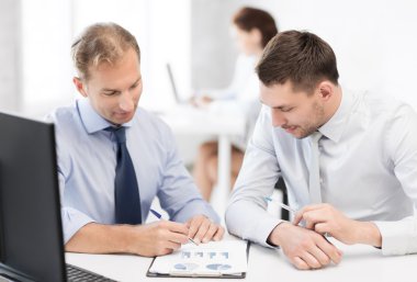 Businessmen with notebook on meeting clipart