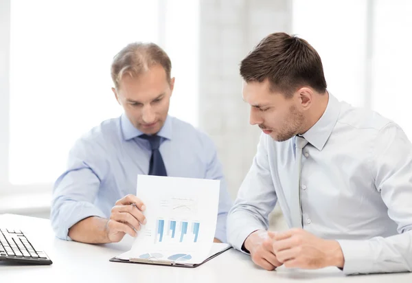 Businessmen with notebook on meeting — Stock Photo, Image