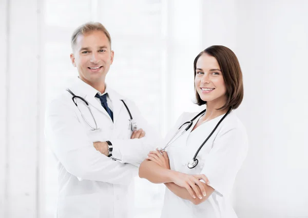 Two young attractive doctors — Stock Photo, Image