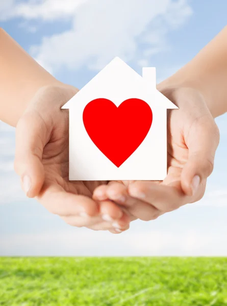 Hands holding white paper house — Stock Photo, Image