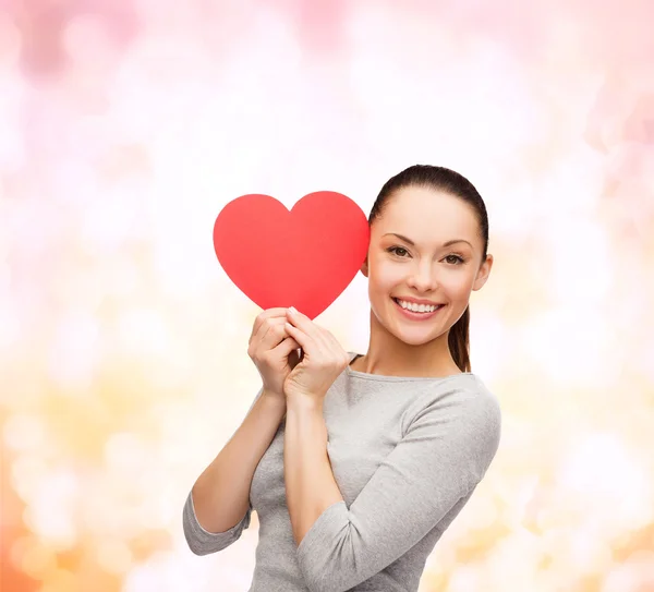 Smiling asian woman with red heart — Stock Photo, Image