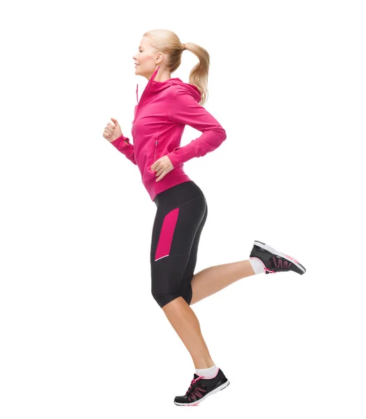 Mujer deportiva corriendo o saltando — Foto de Stock