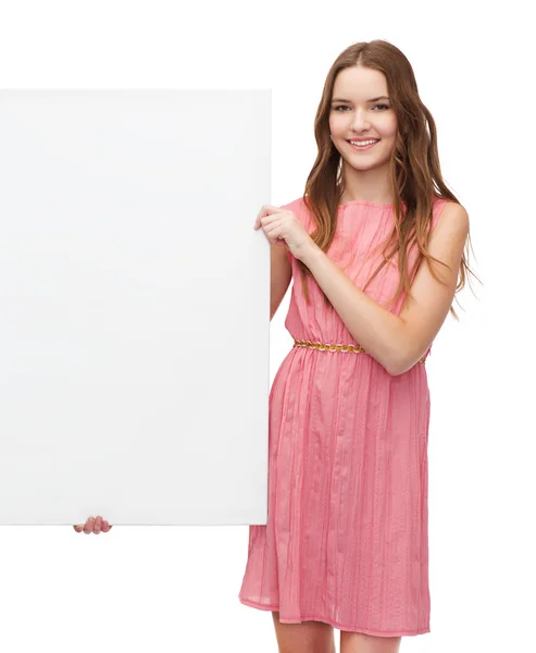 Young woman in dress with white blank board — Stock Photo, Image