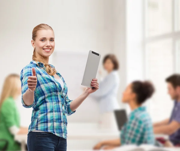 Smiling girl with tablet pc computer at classroom — Stock Photo, Image