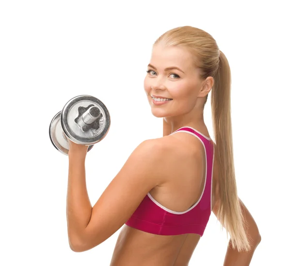 Smiling woman with heavy steel dumbbell — Stock Photo, Image