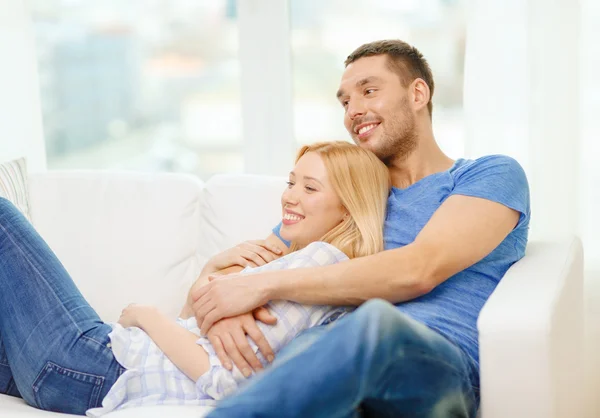 Smiling happy couple at home Royalty Free Stock Photos