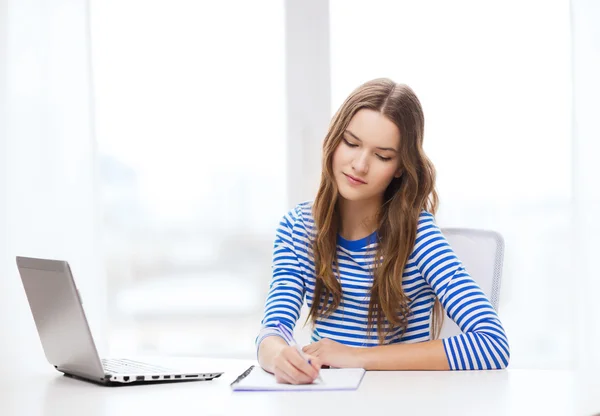 Teenage girl laptop computer and notebook — Stock Photo, Image