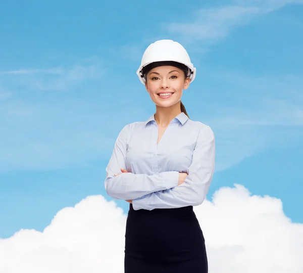 Friendly smiling businesswoman in white helmet — Stock Photo, Image