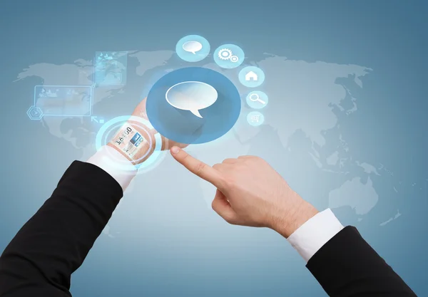 Businessman pointing to virtual watch at his hand — Stock Photo, Image