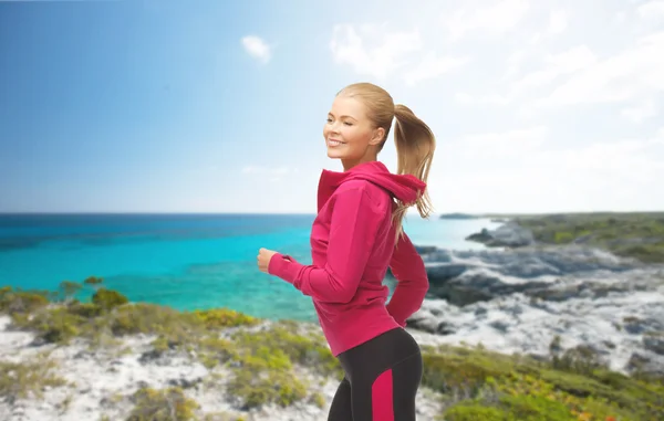 Sporty woman running or jumping — Stock Photo, Image