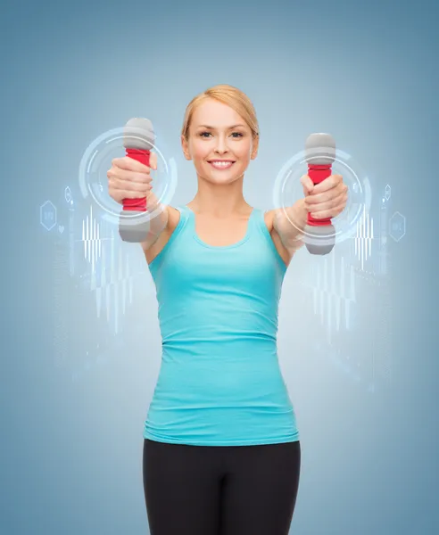 Jeune femme sportive avec haltères légers — Photo