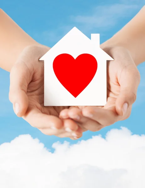 Hands holding white paper house — Stock Photo, Image