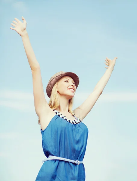 Girl with hands up on the beach — Stock Photo, Image