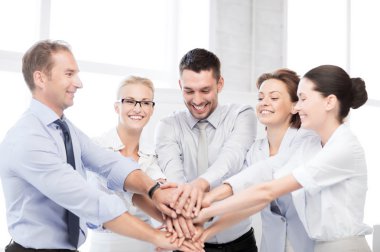 Business team celebrating victory in office clipart