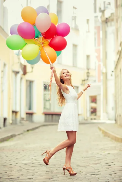 Woman with colorful balloons — Stock Photo, Image