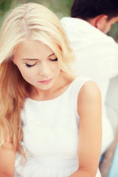 Stressed woman with man outside — Stock Photo, Image