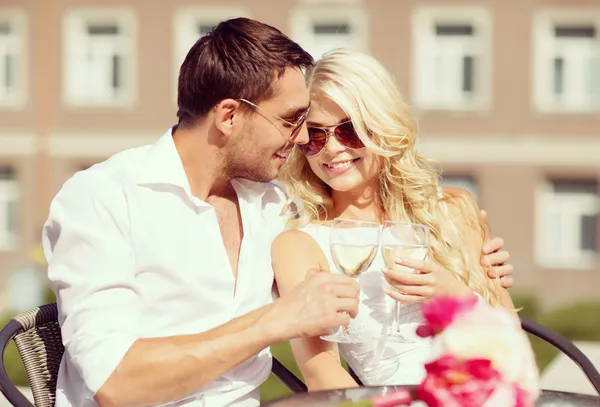 Couple drinking wine in cafe — Stock Photo, Image