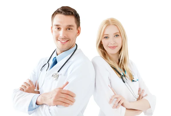Młody lekarz mężczyzna i kobieta pielęgniarka w szpitalu — Zdjęcie stockowe