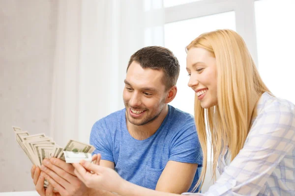 Couple with money at home