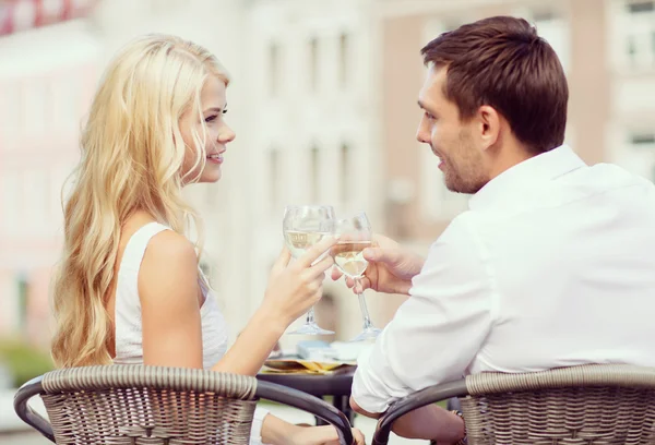 Couple drinking wine in cafe Stock Picture