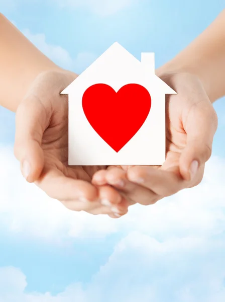 Hands holding white paper house — Stock Photo, Image