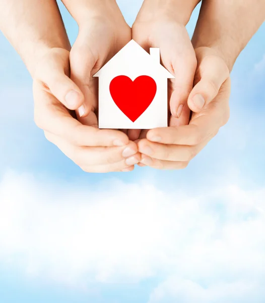 Couple hands holding white paper house — Stock Photo, Image