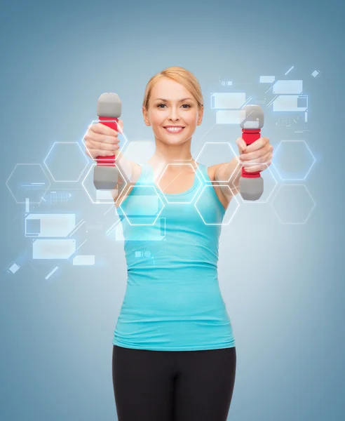 Young sporty woman with light dumbbells — Stock Photo, Image