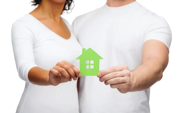 Couple hands holding green house — Stock Photo, Image