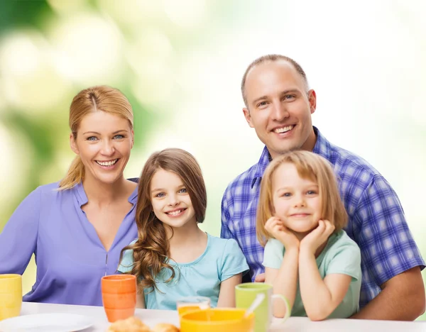 Happy family with two kids with having breakfast — Stock Photo, Image