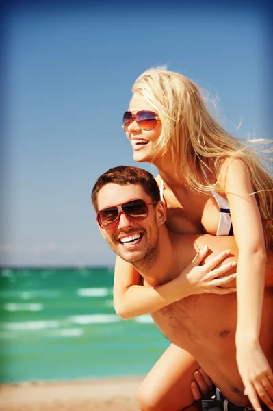 Happy couple in sunglasses on the beach Stock Photo