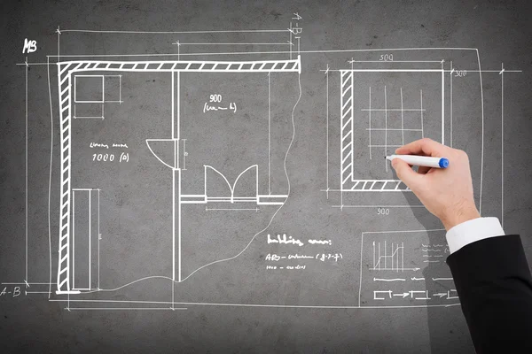 Close up van zakenman tekening blauwdruk — Stockfoto