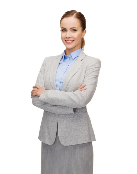 Young smiling businesswoman with crossed arms — Stock Photo, Image