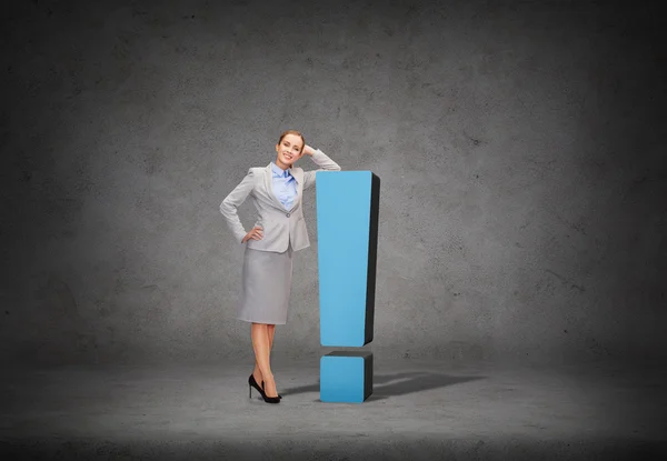 Smiling businesswoman with exclamation mark — Stock Photo, Image