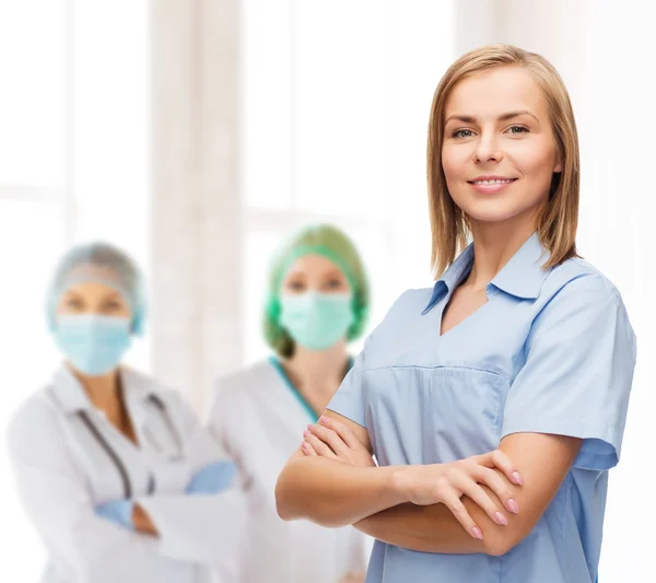 Smiling female doctor or nurse — Stock Photo, Image