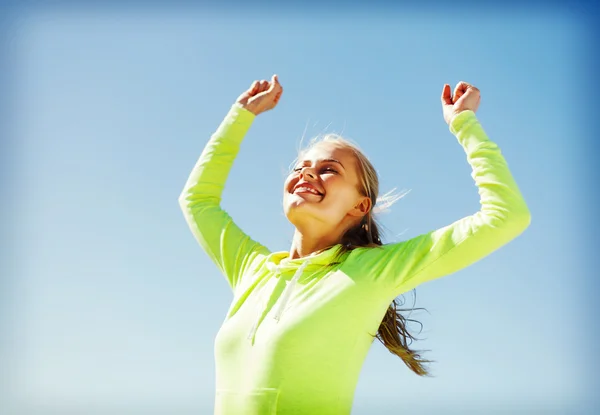 Woman runner celebrating victory — Stock Photo, Image