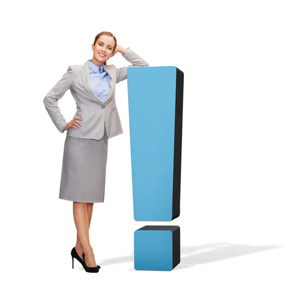 Smiling businesswoman with exclamation mark — Stock Photo, Image