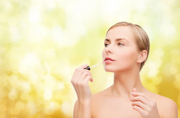 Beautiful woman with lipgloss — Stock Photo, Image