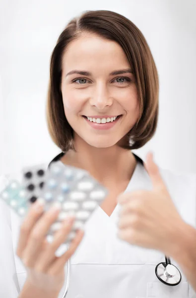Doctor with blister packs of pills — Stock Photo, Image