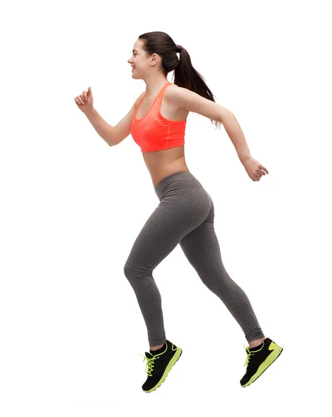 Mujer deportiva corriendo o saltando — Foto de Stock