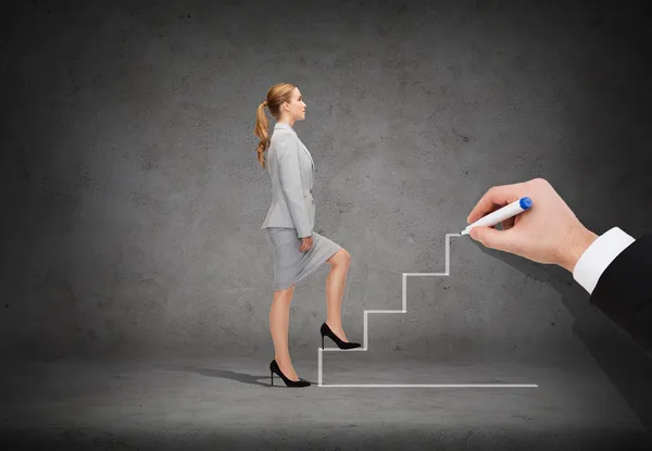 Businesswoman stepping up staircase — Stock Photo, Image