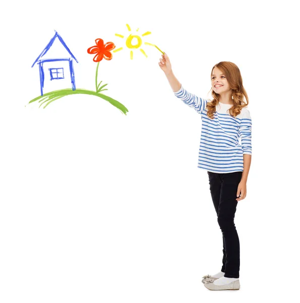 Girl drawing house in the air — Stock Photo, Image