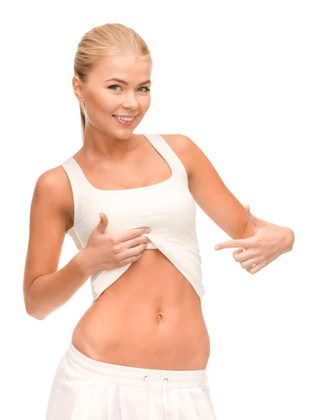 Mooie sportieve woman wijzend op haar abs — Stockfoto