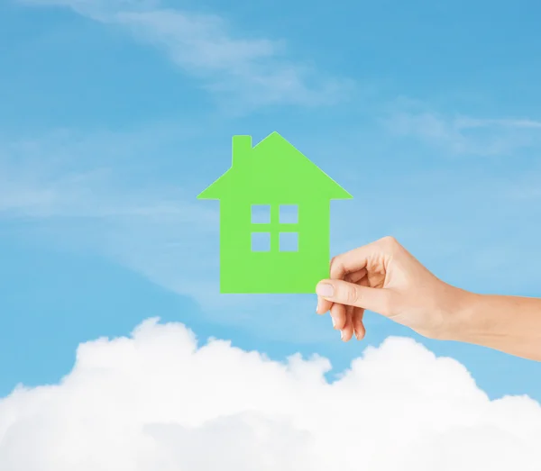 Hand holding green paper house — Stock Photo, Image