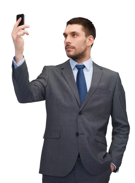 Young businessman with smartphone — Stock Photo, Image