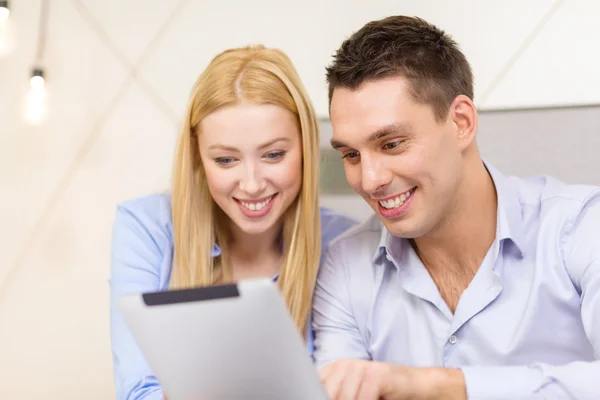 Couple with tablet pc computer in hotel room — Stock Photo, Image
