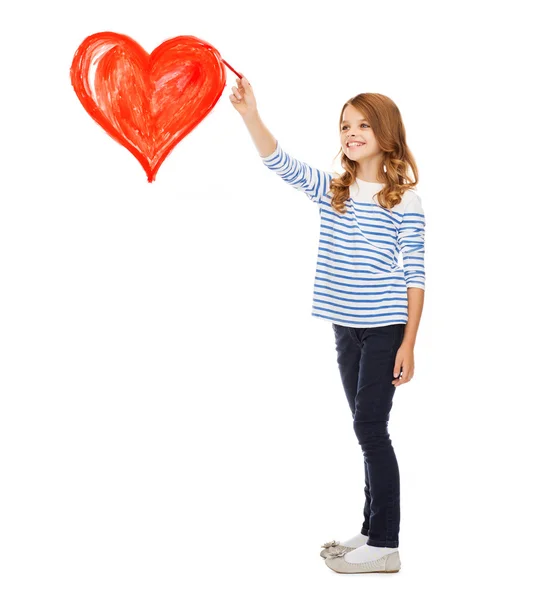 Chica dibujando gran corazón rojo en el aire —  Fotos de Stock