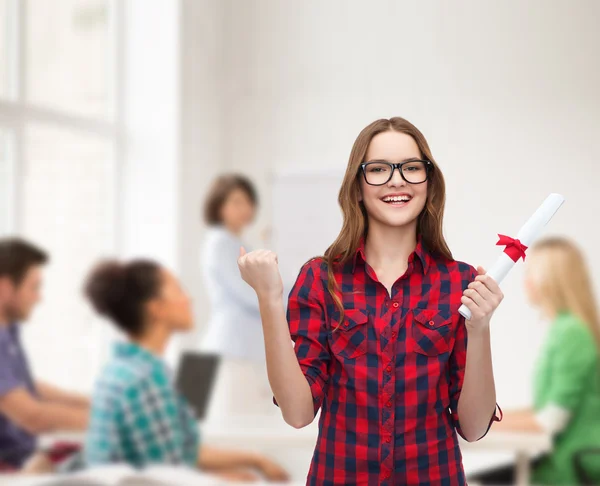 Smiling female student in eyeglasses with diploma — Stock Photo, Image