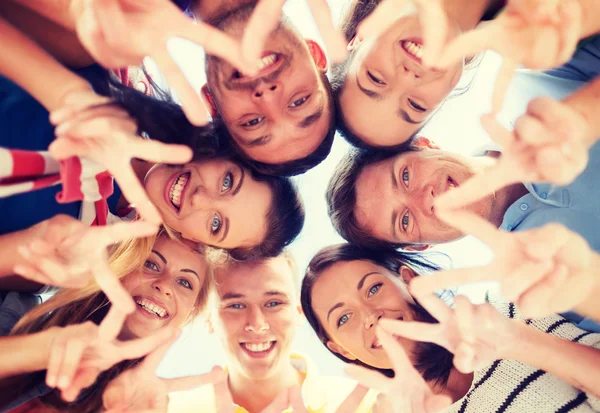 Group of teenagers showing finger five gesture — Stock Photo, Image