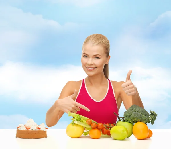 Woman wijzend op gezonde voeding — Stockfoto